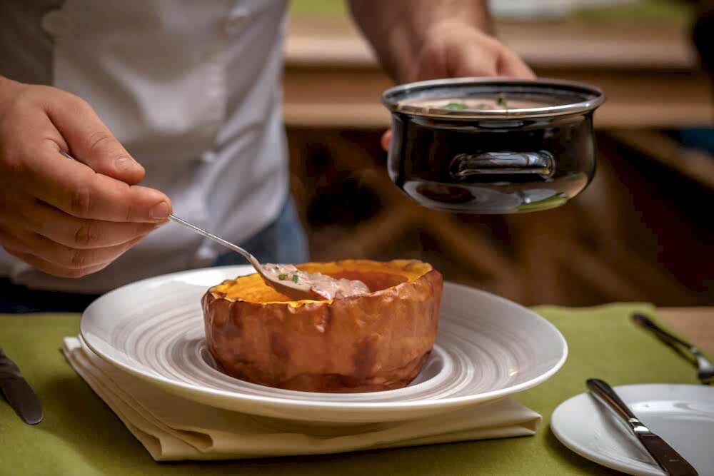 A chef plating a Thanksgiving dish at a Maine restaurant.